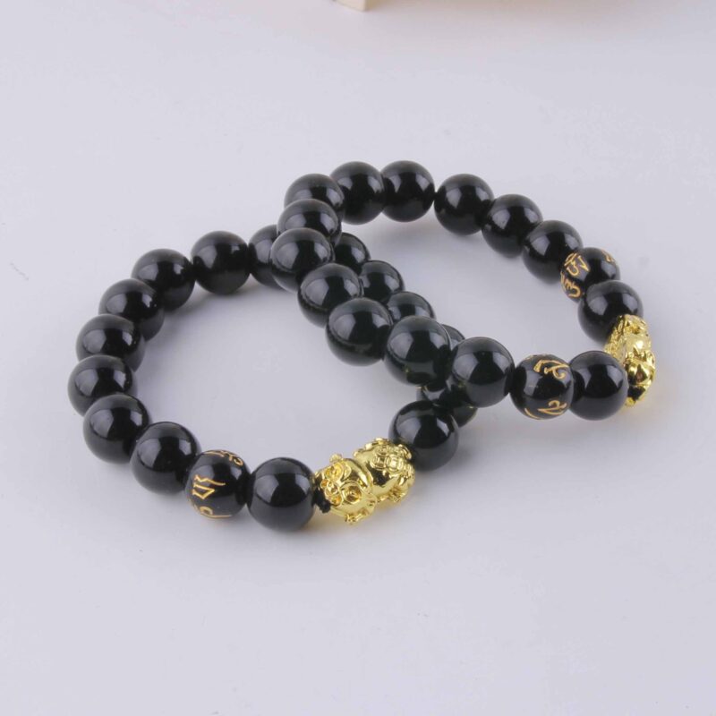 Vòng tay heo vàng hạt đen 1.2